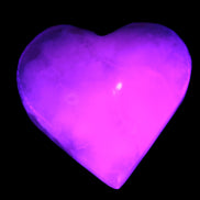 Mangano Calcite hand-carved heart 47-49mm 58-66g in UV light - Rocks and Things Store