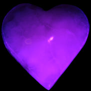 Mangano Calcite hand-carved heart 47-49mm 58-66g in UV light - Rocks and Things Store