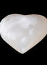 Mangano Calcite hand-carved heart 58g in sunlight - Rocks and Things Store