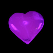 Mangano Calcite hand-carved heart 58g in UV light - Rocks and Things Store