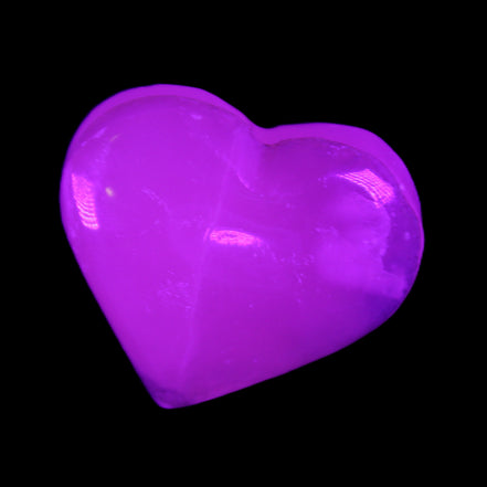 Mangano Calcite hand-carved heart 58g in UV light - Rocks and Things Store