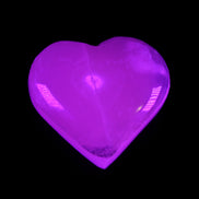 Mangano Calcite hand-carved heart 58g in UV light - Rocks and Things Store