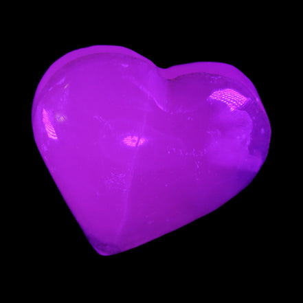 Mangano Calcite hand-carved heart 58g in UV light - Rocks and Things Store