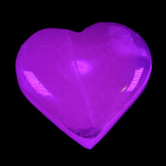 Mangano Calcite hand-carved heart 58g in UV light - Rocks and Things Store