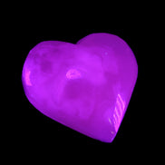 Mangano Calcite hand-carved heart 58g in UV light - Rocks and Things Store