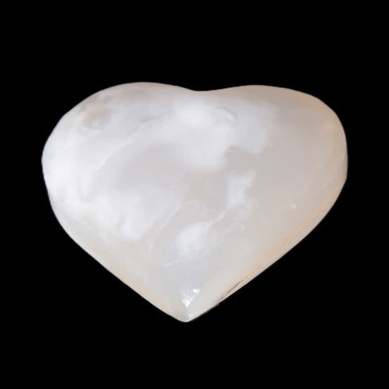 Mangano Calcite hand-carved heart 58g in sunlight - Rocks and Things Store