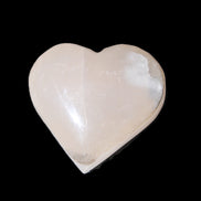 Mangano Calcite hand-carved heart 58g in sunlight - Rocks and Things Store