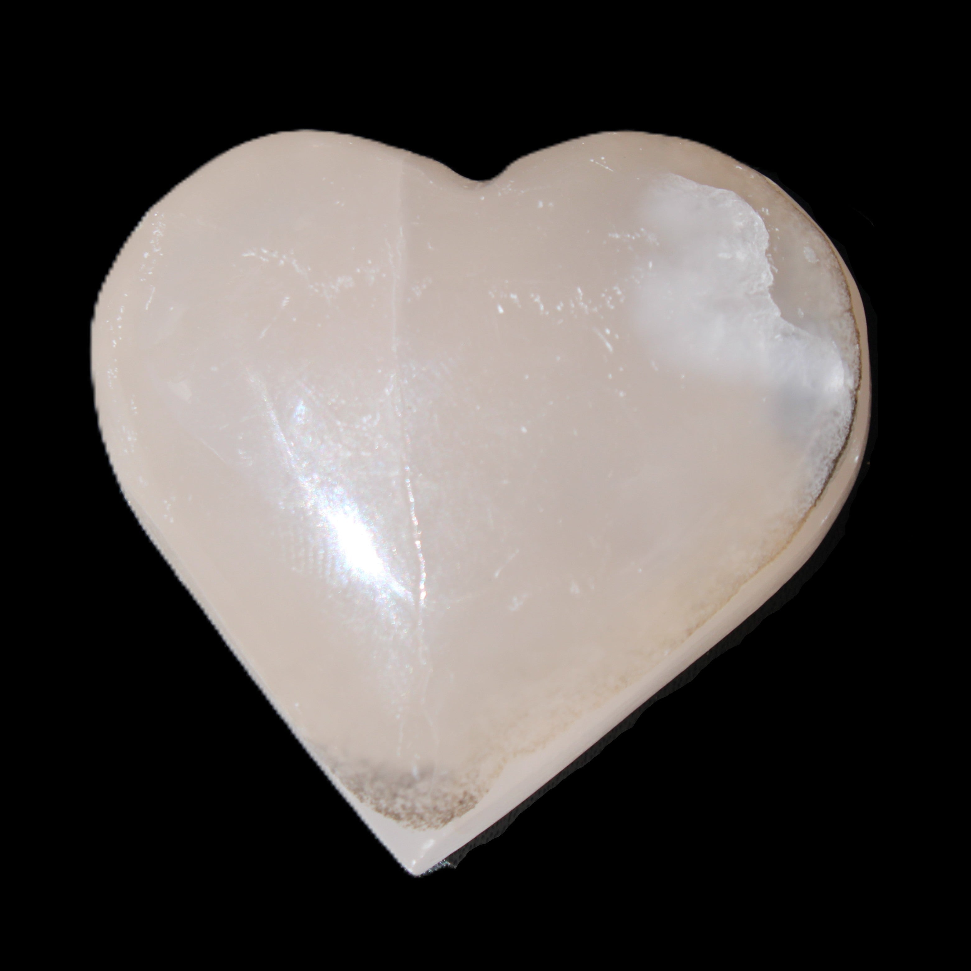 Mangano Calcite hand-carved heart 58g in sunlight - Rocks and Things Store
