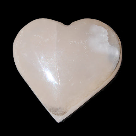 Mangano Calcite hand-carved heart 58g in sunlight - Rocks and Things Store