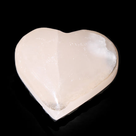 Mangano Calcite hand-carved heart 58g in sunlight - Rocks and Things Store