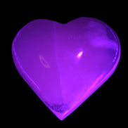 Mangano Calcite hand-carved heart 47-49mm 58-66g in UV light - Rocks and Things Store