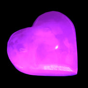 Mangano Calcite hand-carved heart 47-49mm 58-66g in UV light - Rocks and Things Store