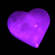 Mangano Calcite hand-carved heart 47-49mm 58-66g in UV light - Rocks and Things Store