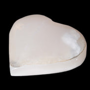 Mangano Calcite hand-carved heart 47-49mm 58-66g in sunlight - Rocks and Things Store