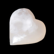 Mangano Calcite hand-carved heart 47-49mm 58-66g in sunlight - Rocks and Things Store