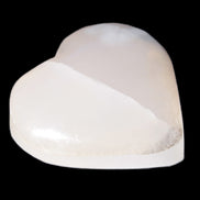 Mangano Calcite hand-carved heart 47-49mm 58-66g in sunlight - Rocks and Things Store