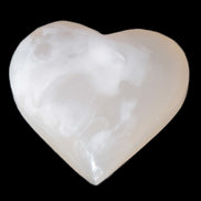 Mangano Calcite hand-carved heart 47-49mm 58-66g in sunlight - Rocks and Things Store