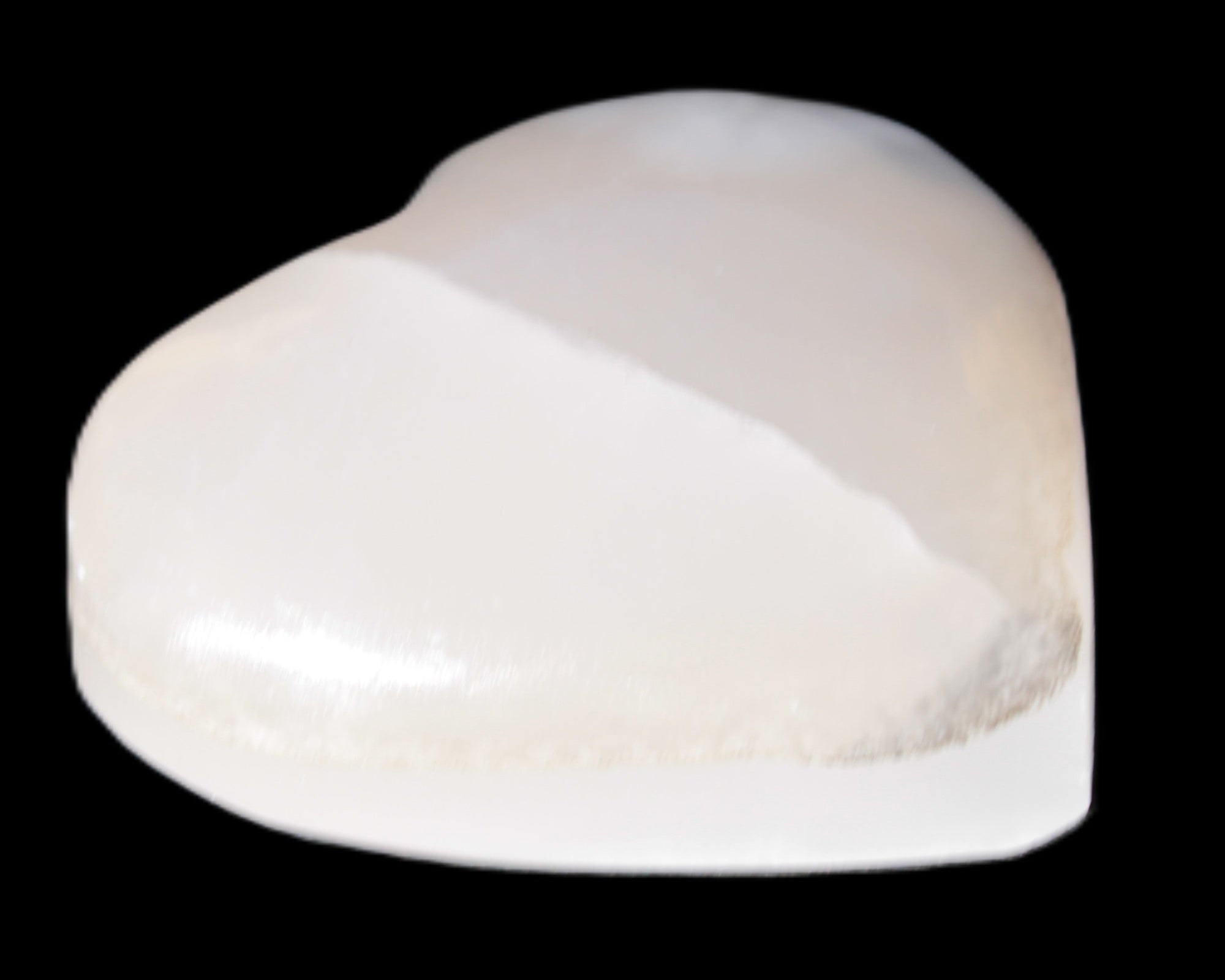 Mangano Calcite hand-carved heart 47-49mm 58-66g in sunlight - Rocks and Things Store