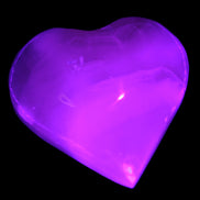 Mangano Calcite hand-carved heart 47-49mm 58-66g in UV light - Rocks and Things Store