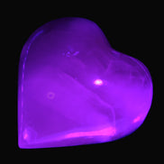 Mangano Calcite hand-carved heart 47-49mm 58-66g in UV light - Rocks and Things Store