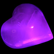 Mangano Calcite hand-carved heart 47-49mm 58-66g in UV light - Rocks and Things Store