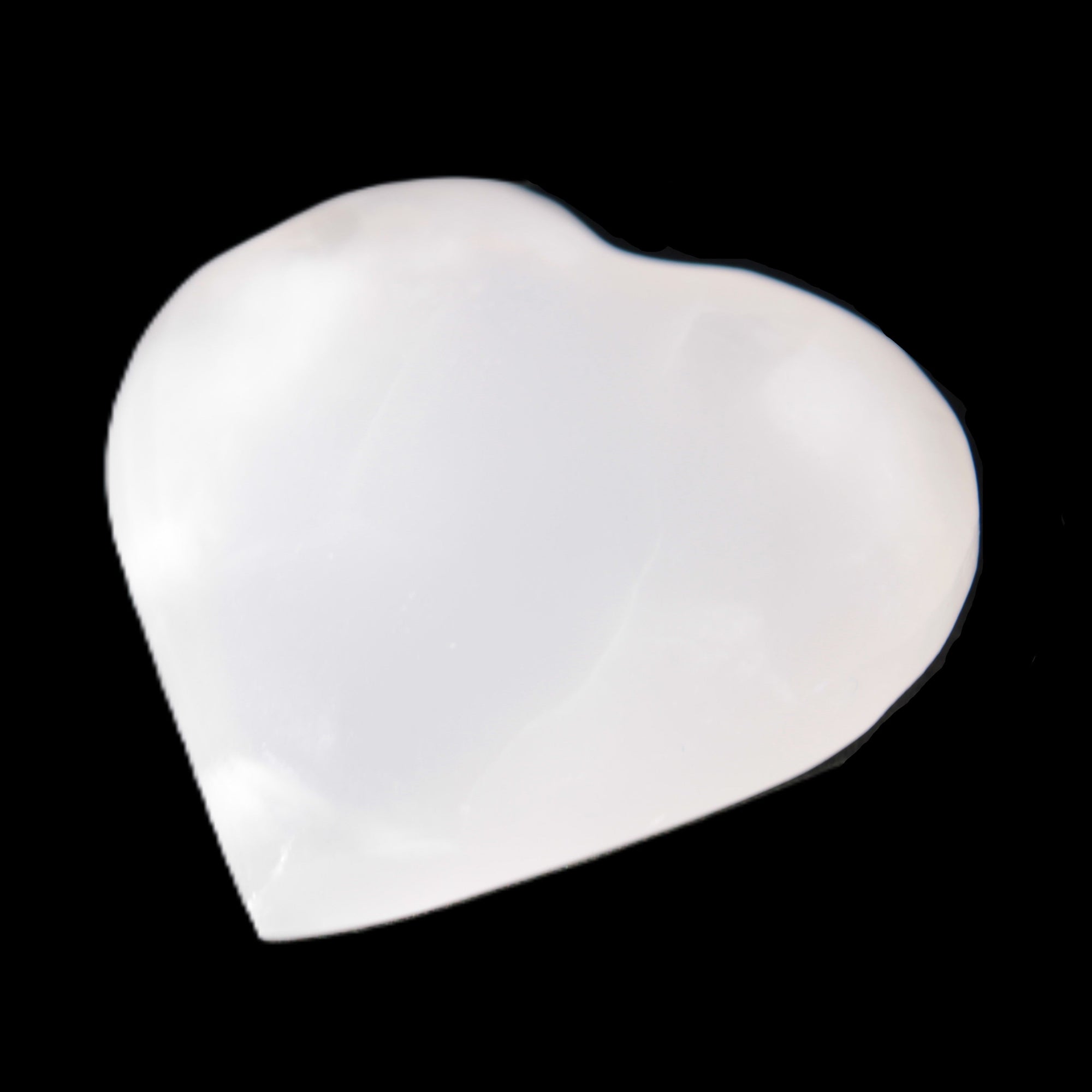 Mangano Calcite heart 38-44mm 36-39g in sunlight - Rocks and Things Store