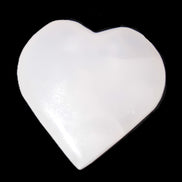 Pink Mangano Calcite heart 41-44mm 44-49g in sunlight -  Rocks and Things Store