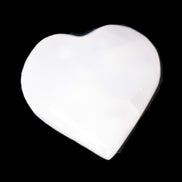 Pink Mangano Calcite heart 41-44mm 44-49g in sunlight - Rocks and Things Store