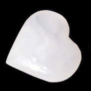 Pink Mangano Calcite heart 41-44mm 44-49g in sunlight - Rocks and Things Store