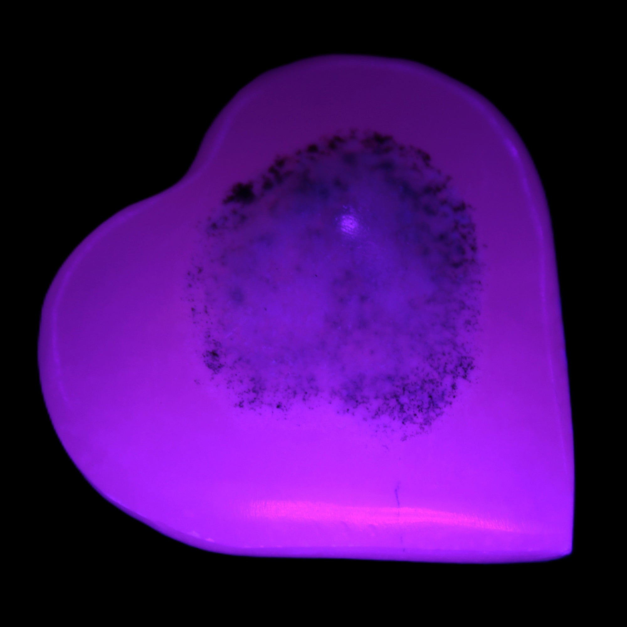 Pink Mangano Calcite heart 41-44mm 44-49g in UV light - Rocks and Things Store