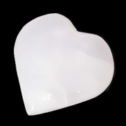 Pink Mangano Calcite heart 41-44mm 44-49g in sunlight - Rocks and Things Store