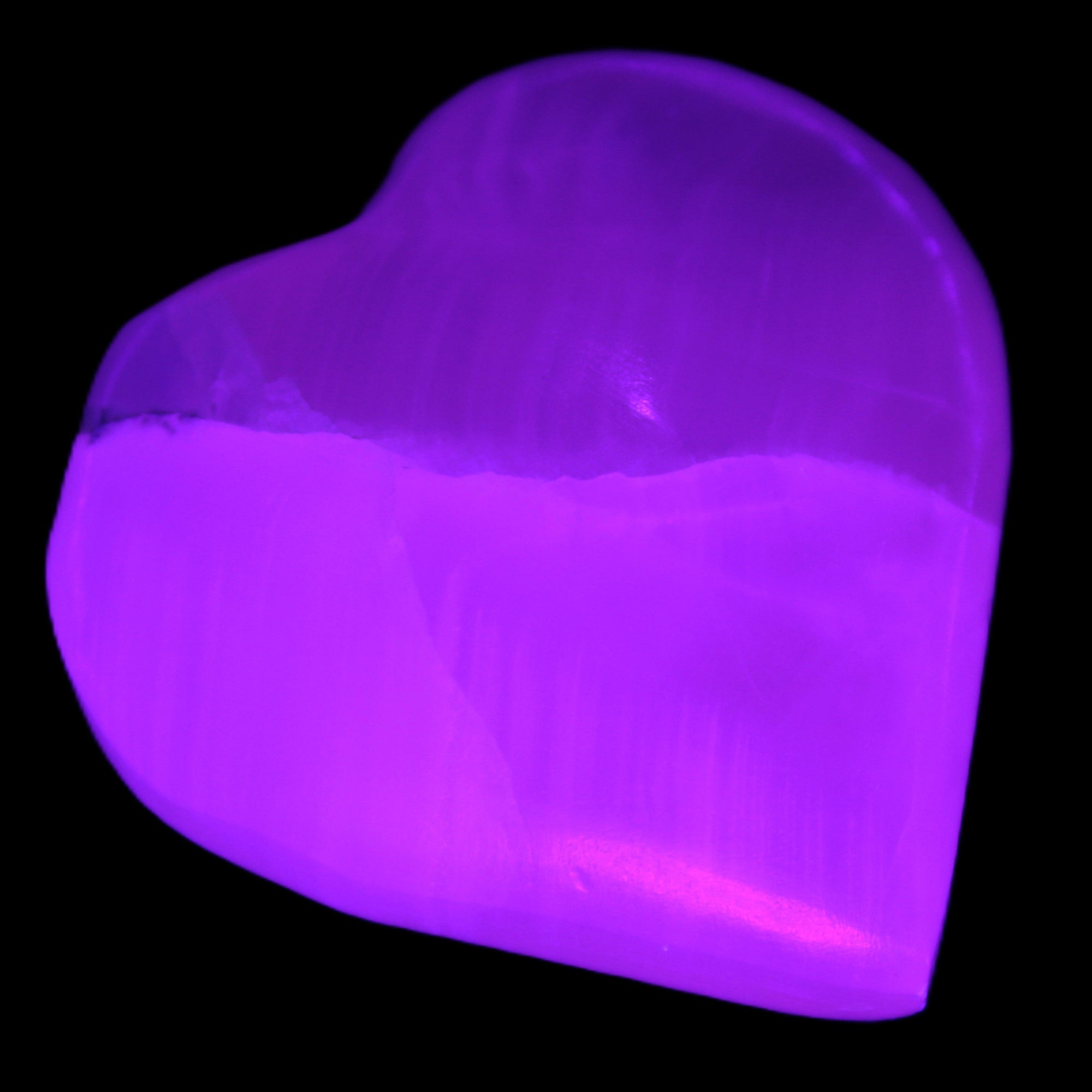 Pink Mangano Calcite heart 41-44mm 44-49g in UV light - Rocks and Things Store
