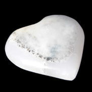 Mangano Calcite hand-carved heart 35-41mm 33-40g in sunlight - Rocks and Things Store