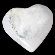 Mangano Calcite hand-carved heart 35-41mm 33-40g in sunlight - Rocks and Things Store