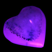 Mangano Calcite hand-carved heart 35-41mm 33-40g in UV light - Rocks and Things Store