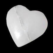 Mangano Calcite hand-carved heart 35-41mm 33-40g in sunlight - Rocks and Things Store