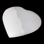 Mangano Calcite hand-carved heart 35-41mm 33-40g in sunlight - Rocks and Things Store