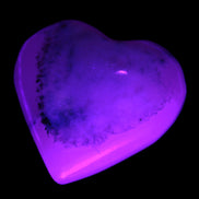 Mangano Calcite hand-carved heart 35-41mm 33-40g in sunlight - Rocks and Things Store