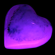 Mangano Calcite hand-carved heart 35-41mm 33-40g in UV light - Rocks and Things Store