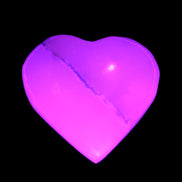 Mangano Calcite hand-carved heart 35-41mm 33-40g in UV light - Rocks and Things Store
