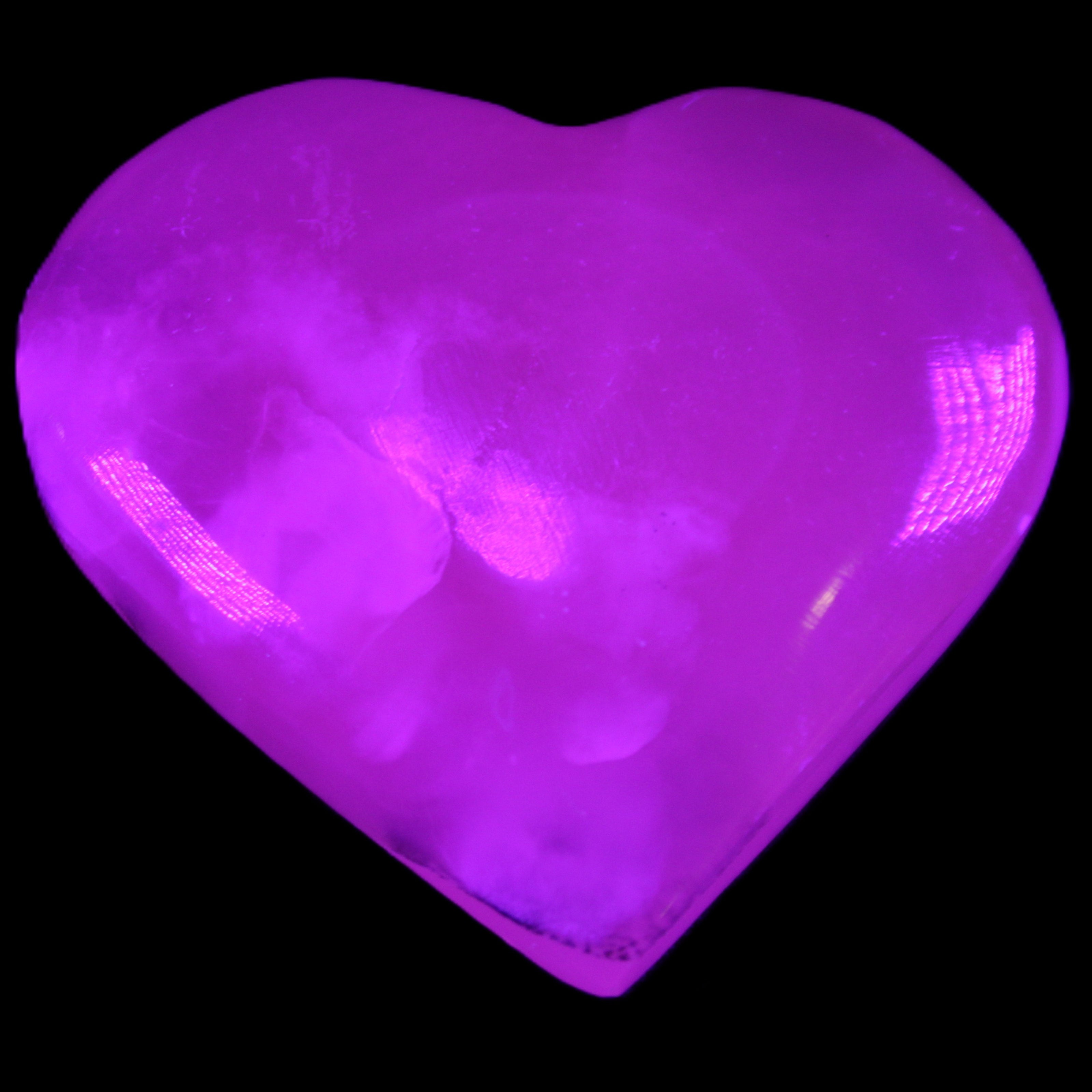 Mangano Calcite hand-carved heart 67*64mm 125g in UV light - Rocks and Things Store