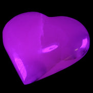 Mangano Calcite hand-carved heart 67*64mm 125g in UV light - Rocks and Things Store