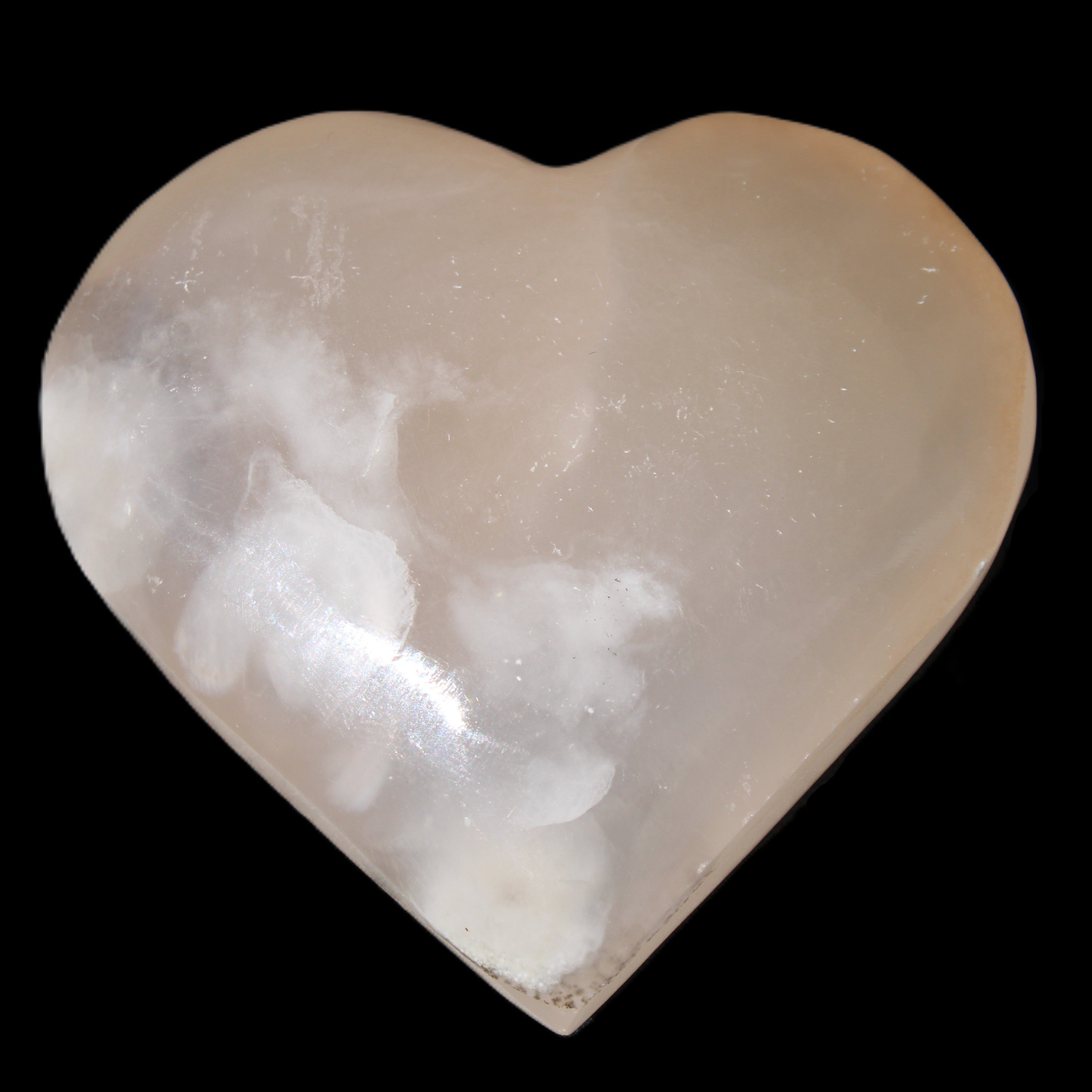 Mangano Calcite hand-carved heart 67*64mm  125g in sunlight - Rocks and Things Store