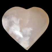 Mangano Calcite hand-carved heart 67*64mm  125g in sunlight - Rocks and Things Store