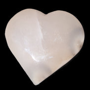 Mangano Calcite hand-carved heart 67*64mm  125g in sunlight - Rocks and Things Store