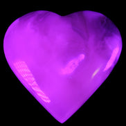 Mangano Calcite hand-carved heart 73*78*20mm 160g in UV light - Rocks and Things Store