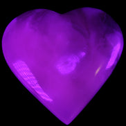 Mangano Calcite hand-carved heart 73*78*20mm 160g in UV light - Rocks and Things Store