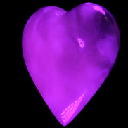 Mangano Calcite hand-carved heart 73*78*20mm 160g in UV light - Rocks and Things Store