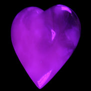 Mangano Calcite hand-carved heart 73*78*20mm 160g in UV light - Rocks and Things Store
