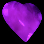 Mangano Calcite hand-carved heart 73*78*20mm 160g in UV light - Rocks and Things Store